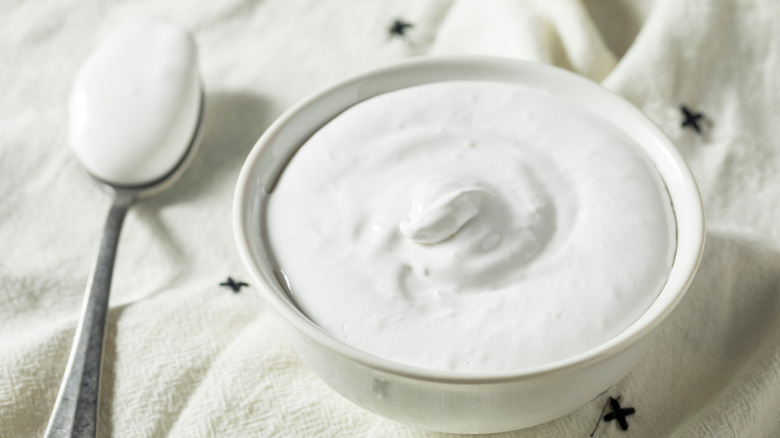Bowl and spoon of homemade marshmallow creme