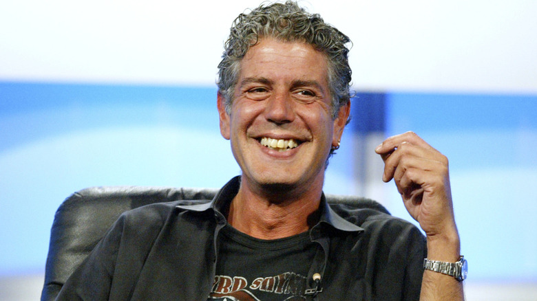 Anthony Bourdain seated, smiling