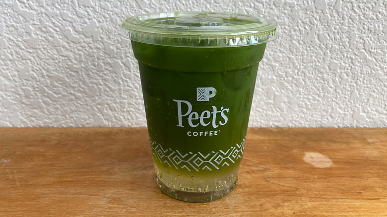 Sparkling Peach Matcha on wooden table