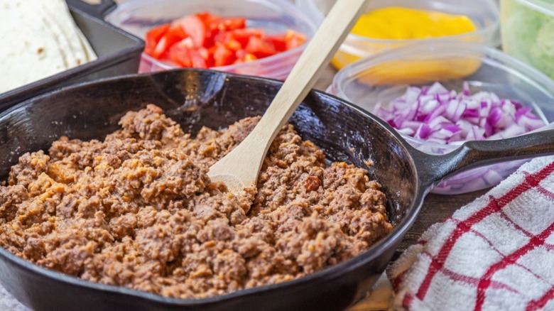 Ground beef in a cast iron skillet.