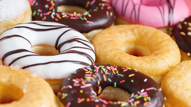 White frosted, chocolate frosted, and glazed doughnuts