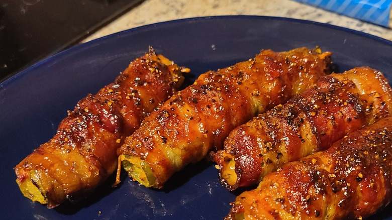 Smoked bacon wrapped cheeseburger pickle poppers