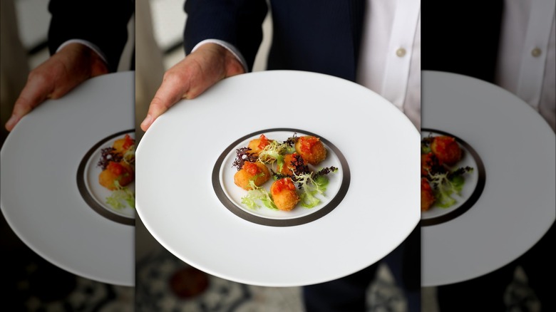 Bas Rouge server with plate