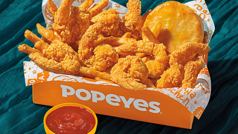 Popeyes Shrimp Tacklebox with a biscuit and cocktail sauce