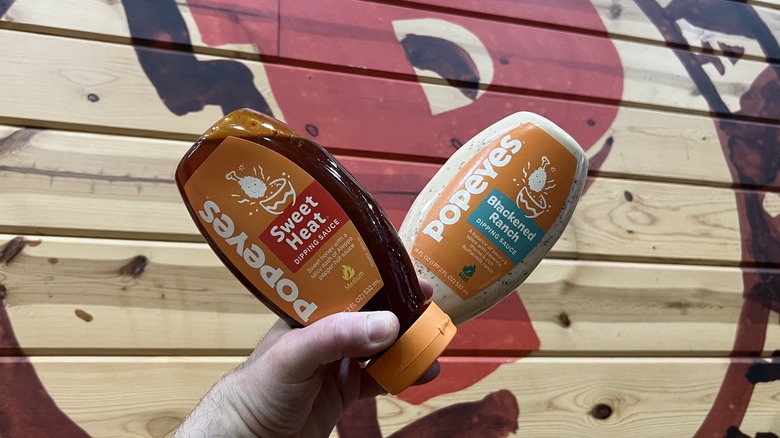 two Popeyes sauce bottles