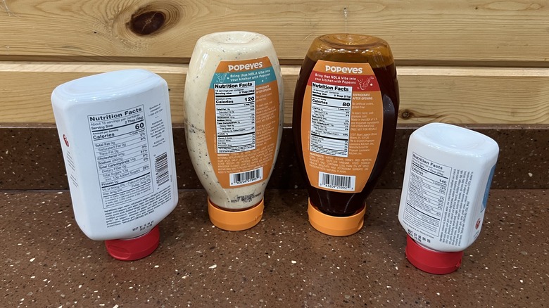 the back of four sauce bottles