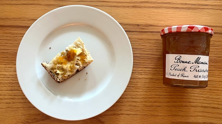 Bonne Maman peach preserves on a piece of toast