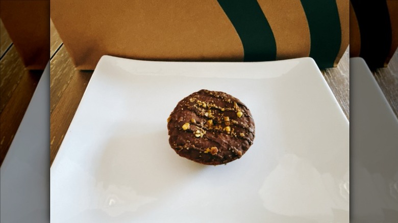 Starbucks Dubai Chocolate Bite on a white plate with Starbucks bag in the background