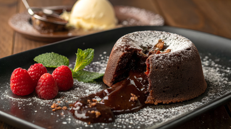 Chocolate lava cake with raspberries and ice cream