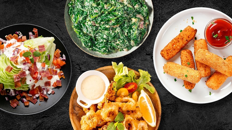 Composite of steakhouse sides on black background