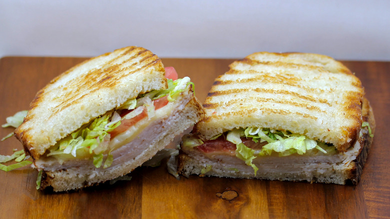 a Wawa turkey and cheese panini sliced in half