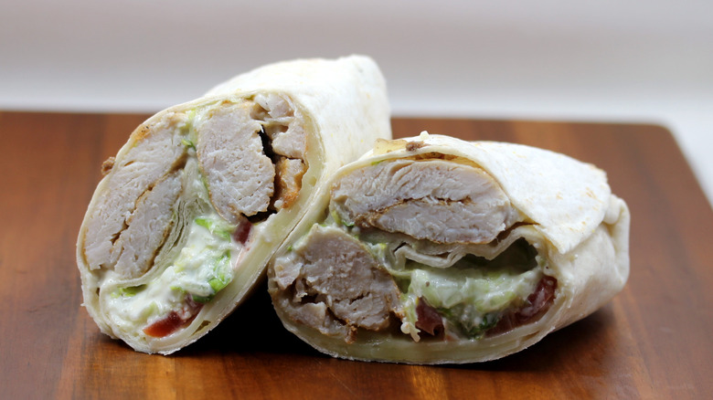 a Wawa Chicken Caesar Wrap sliced in half