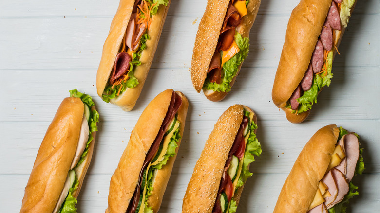 a variety of hoagies on a table