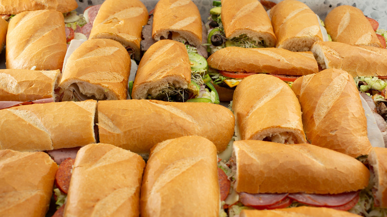 a tray of assorted hoagies or subs