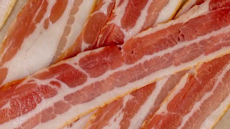 Slices of fresh pork bacon