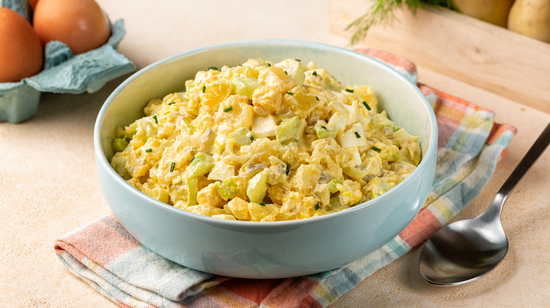 Bowl of potato salad with spoon