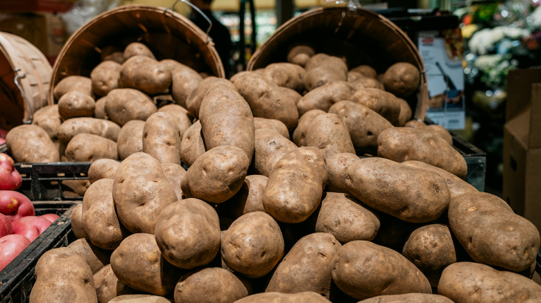 Bin of potatoes at a supermarket
