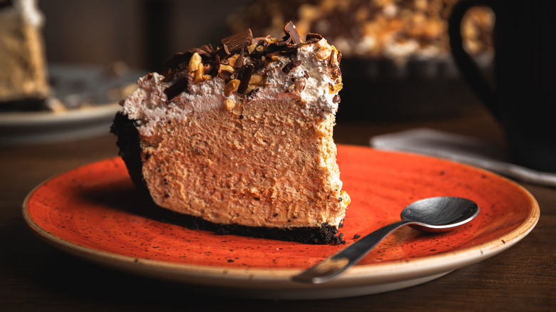 Slice of peanut butter pie with chocolate cookie crust