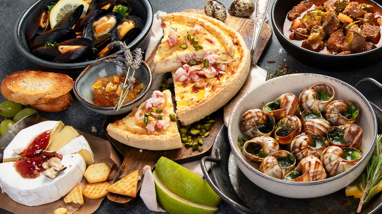 Assortment of French foods on dark surface
