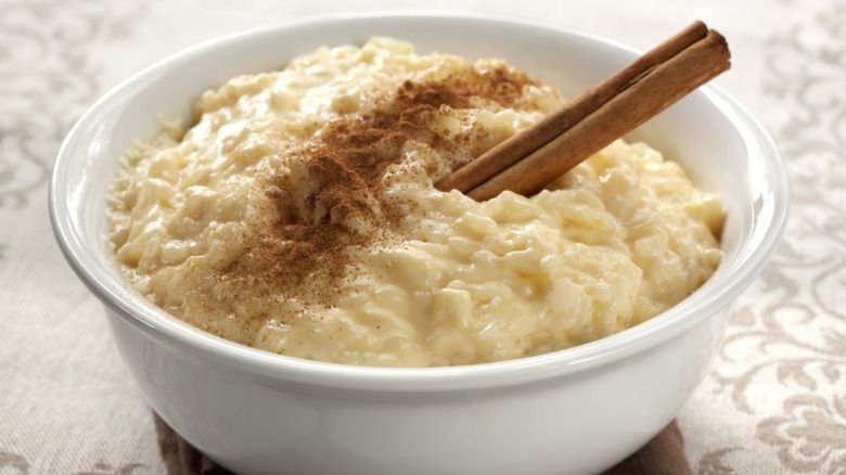 A bowl of rice pudding with cinnamon.