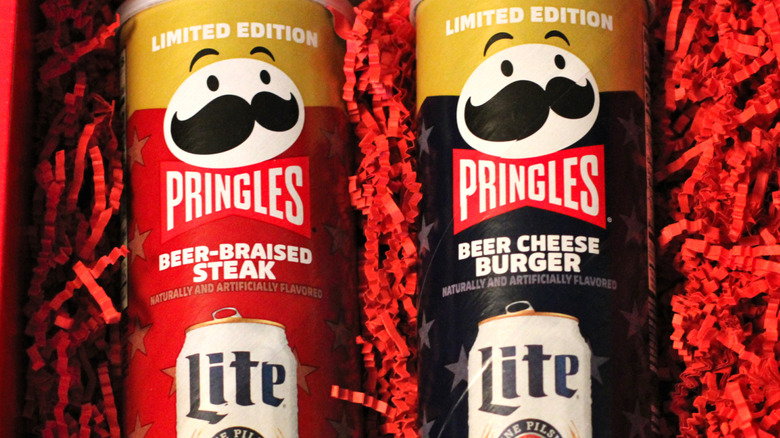 Limited edition Pringles x Miller Lite 2026 collaborative chips, beer-braised steak and beer cheese burger, on a plate
