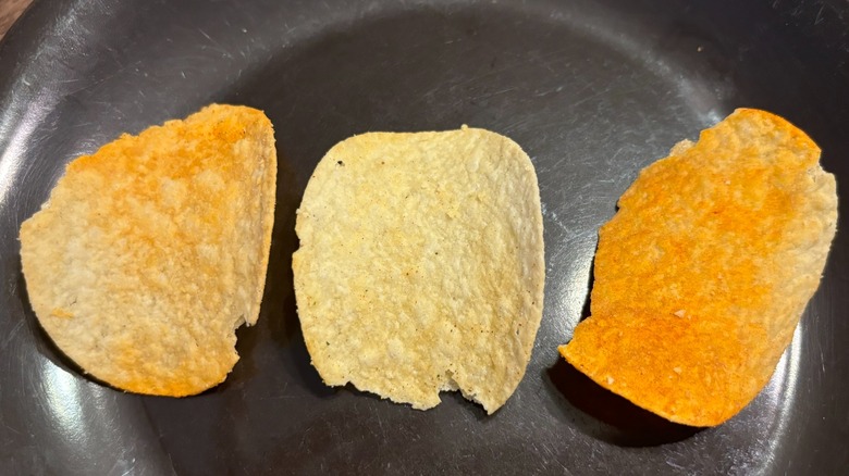 close up of Pringles and Buffalo Wild Wings chips on a brown plate