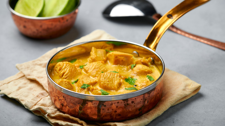 Chicken curry in a copper pan