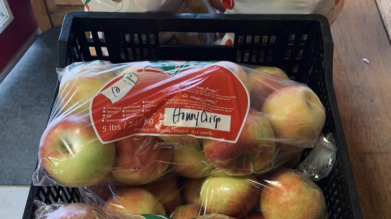 Bag of apples in crate