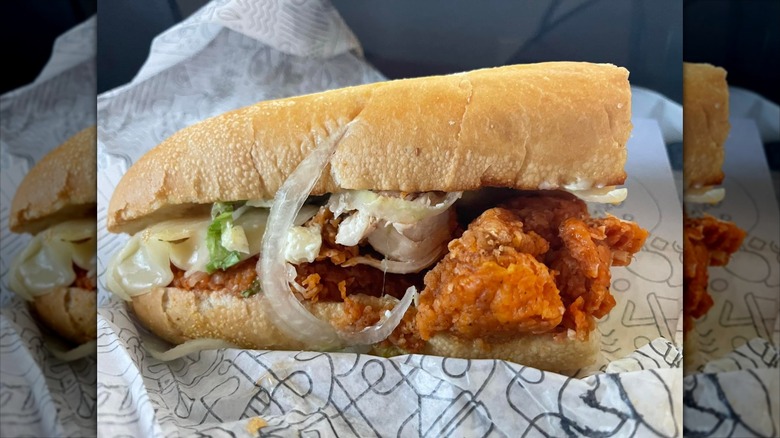 A chicken sub sandwich on paper
