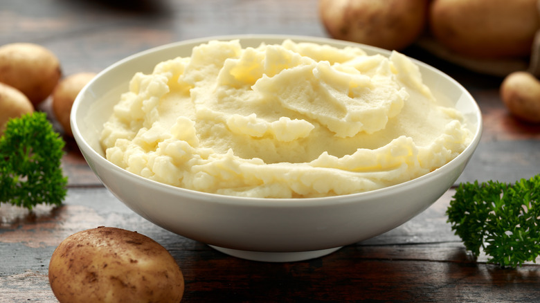 A bowl of mashed potatoes on a table