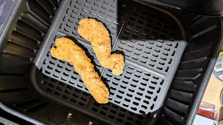 QVC chicken strips in the basket of an air fryer