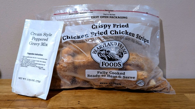 Package of QVC chicken strips with a packet of gravy