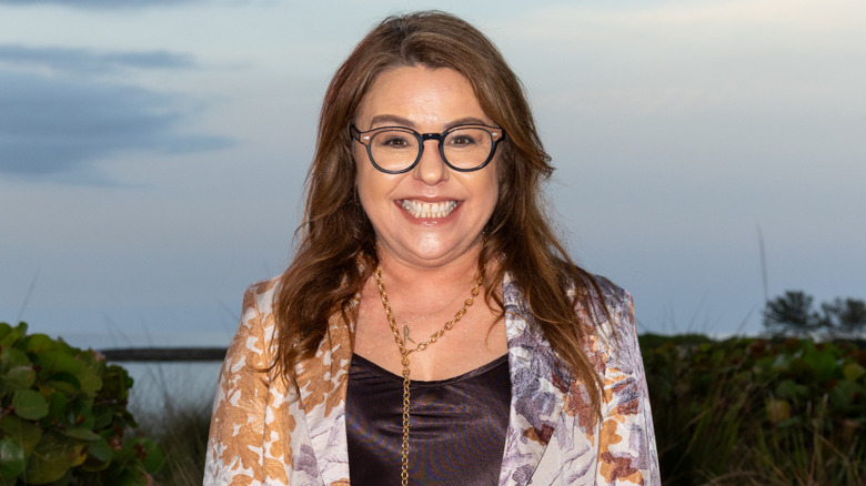 Rachael Ray posing for camera outdoors