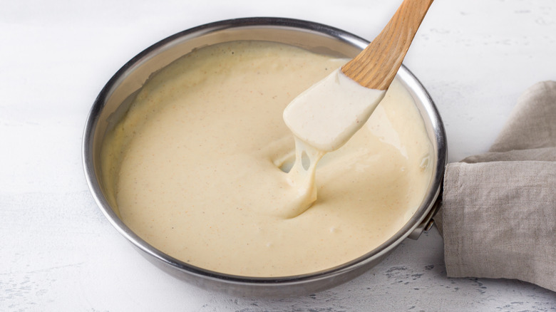A pan full of cheese roux sauce