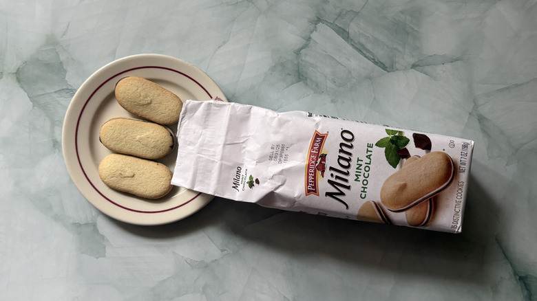 Milano Mint Chocolate cookies on a plate beside the bag