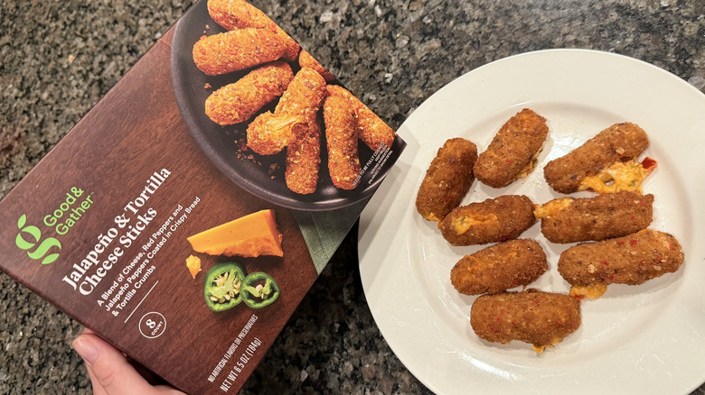 Jalapeño and Tortilla Cheese Sticks on plate with box nearby
