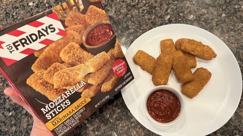 TGI Fridays mozzerella sticks on a plate with box