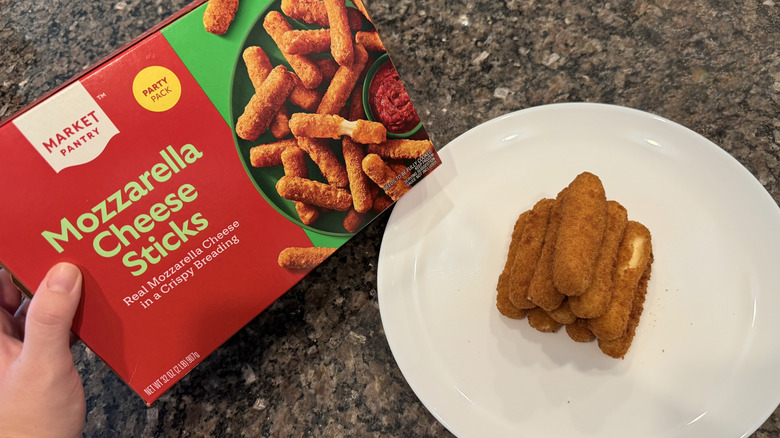 Market Pantry mozzarella sticks on plate next to a box