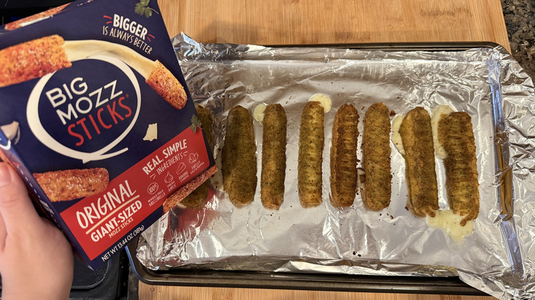 Big Mozz sticks with cheese spilling out on a pan