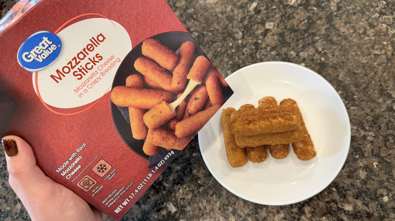 Great Value mozzarella sticks on a plate next to a box
