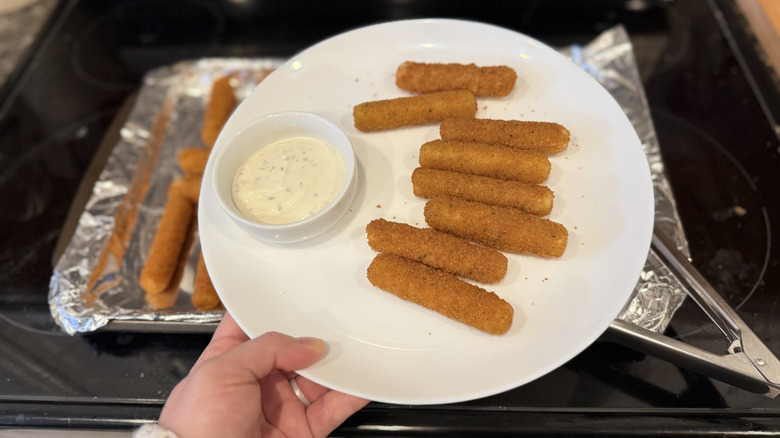 Mozzarella sticks on a plate with ranch dip