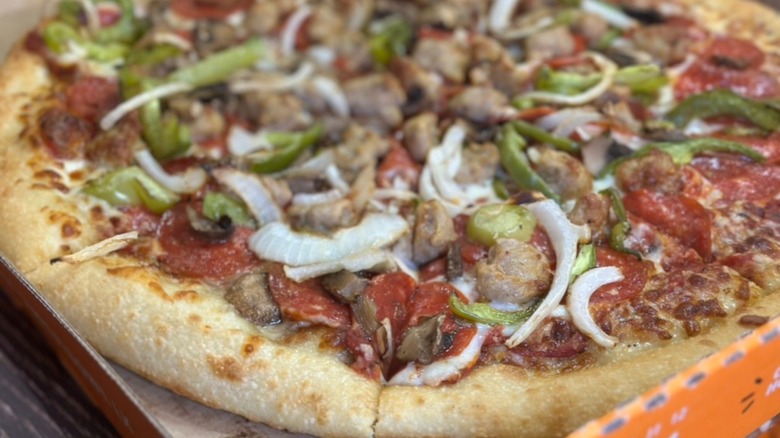 Ultimate Supreme Pizza close up to camera