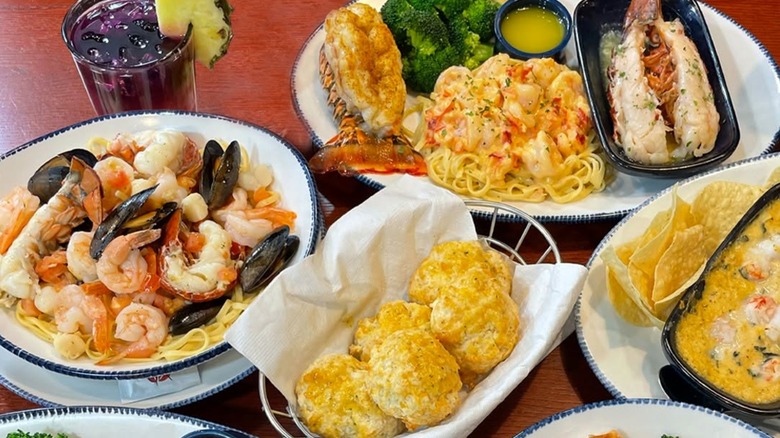 Seafood dishes at Red Lobster and a basket of cheese biscuits.