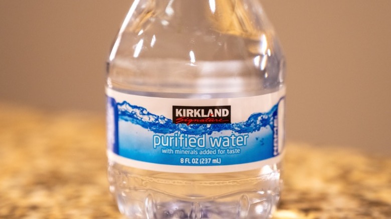 A small bottle of Kirkland Signature water.