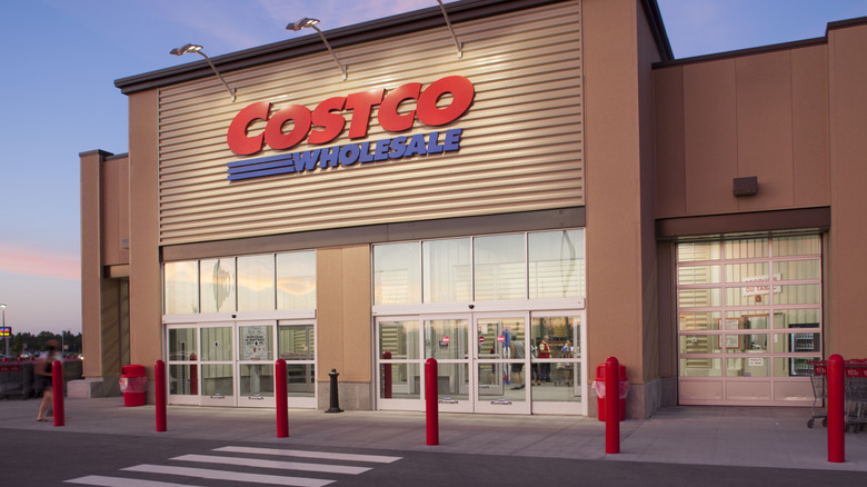 Illuminated exterior entrance of a Costco warehouse