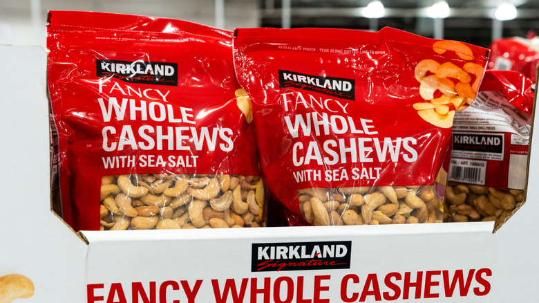 Bags of Kirkland Signature fancy whole cashews on display at Costco