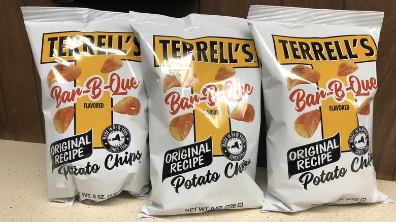Three white bags of Terrell's Bar-B-Que chips on counter