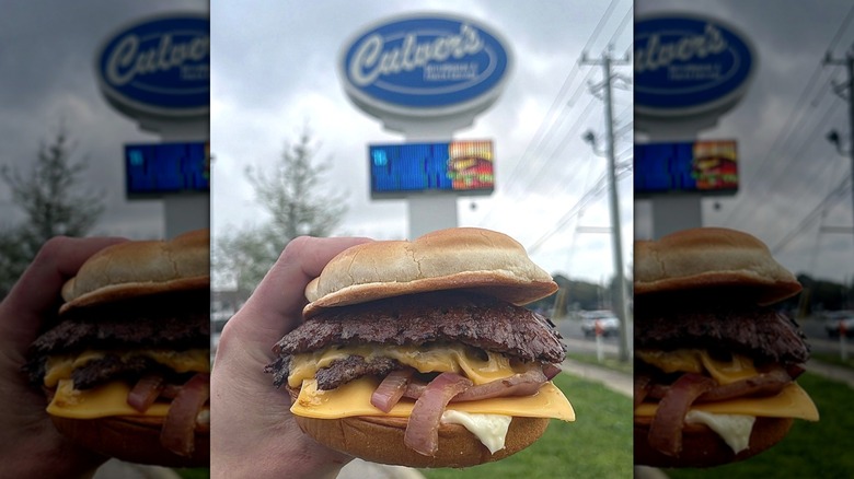 Hand holding a Culver's burger