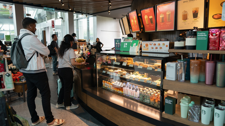 The inside of a Starbuck's with customers ordering