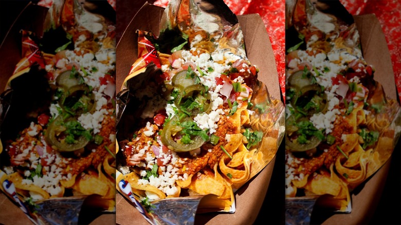 Corn chips covered in cotija cheese, chili, Indian pico de gallo, and tamarind chutney